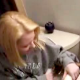 A blonde girl is video recorded on the toilet ready to wipe herself. This is a very brief clip.
